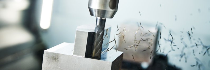 CNC milling machine performing subtractive manufacturing